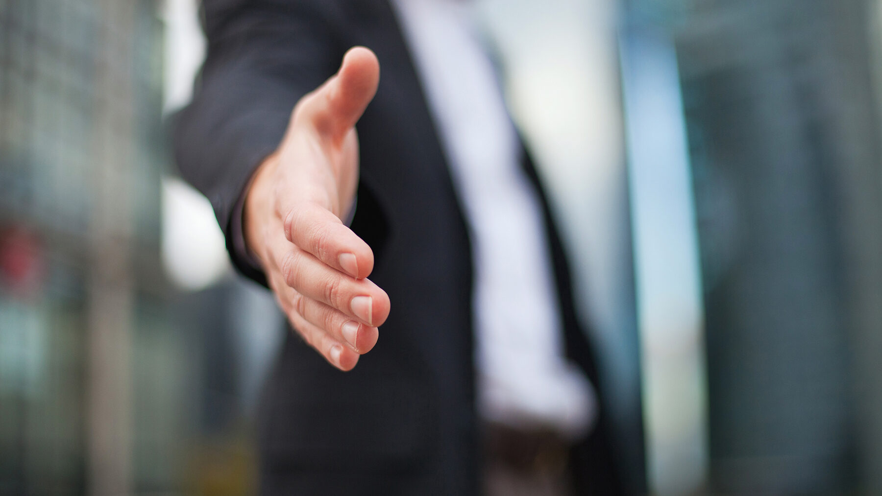 hand outstretched toward  camera